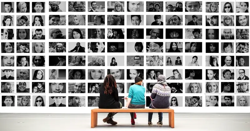 Three people in front of photowall