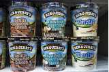 Two rows of Ben & Jerry's ice cream tubs in various flavours.