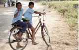 two boys on a bicycle